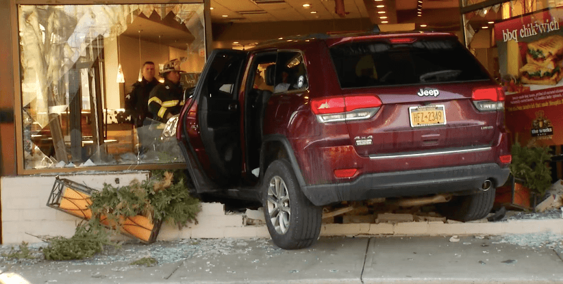 Narrow Miss, Red SUV Crashes Into Latham's Work Cafe